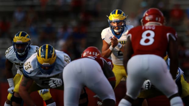 Sep 18, 2021; Piscataway, New Jersey, USA; Delaware Fightin Blue Hens quarterback Nolan Henderson (2) prepares for the snap in front of Rutgers Scarlet Knights linebacker Tyshon Fogg (8) during the second half at SHI Stadium. Mandatory Credit: Vincent Carchietta-USA TODAY Sports